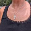 Silver dichroic cross pendant with coin for scale