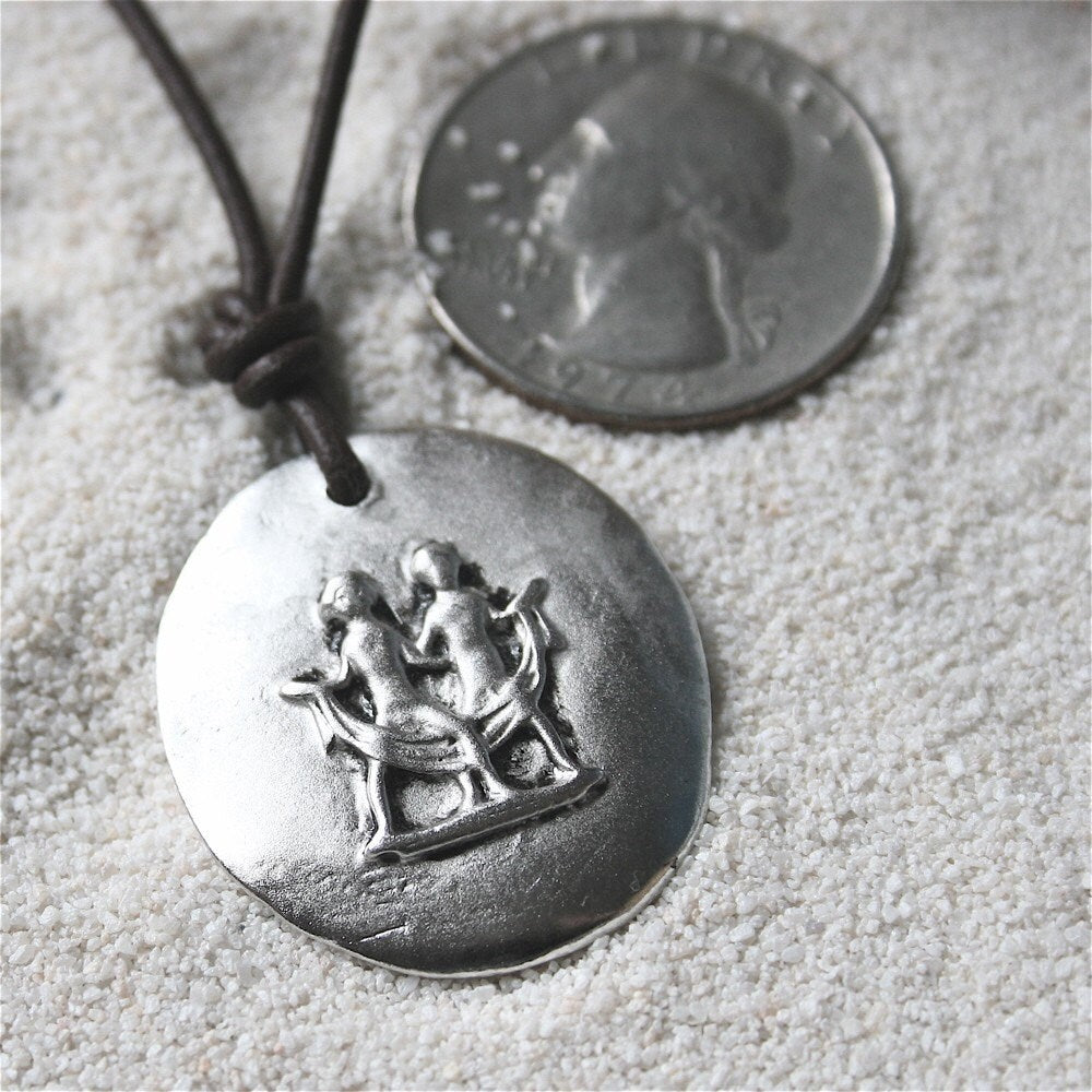 Gemini zodiac charm necklace, white metal on leather cord