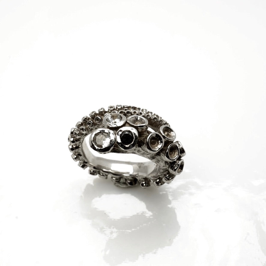 14k white gold octopus tentacle ring, close-up detail of suction cup gemstone settings