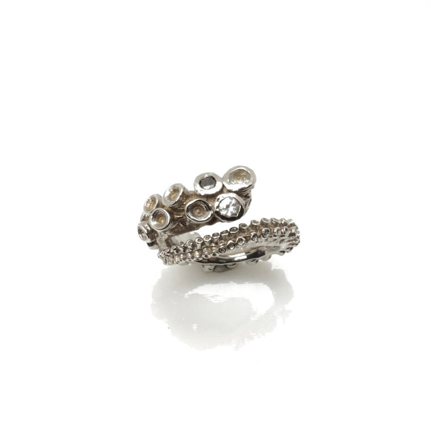 14k white gold octopus tentacle ring product photo, top-down view on white background