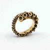 Octopus tentacle ring in 14k yellow gold, AI-rendered studio shot