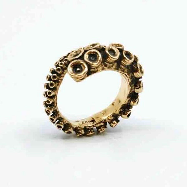 Octopus tentacle ring in 14k yellow gold, AI-rendered studio shot
