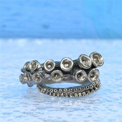 Octopus tentacle ring in solid white brass, adjustable open shank, front view