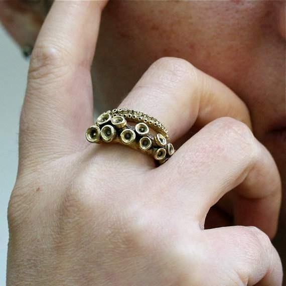 Close-up of suction cup detail on the yellow brass octopus tentacle ring