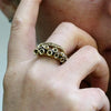 Close-up of suction cup detail on the yellow brass octopus tentacle ring
