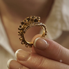Octopus tentacle ring in 14k yellow gold, AI-rendered macro detail