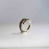 Small octopus tentacle ring in sterling silver, angled design view