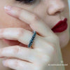 Small octopus tentacle ring in sterling silver, worn on hand