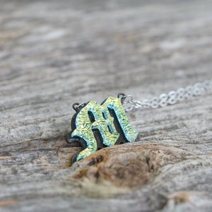 Initial letter Necklace M Old English Font Gold color Fused Dichroic Glass on a Stainless Steel base
