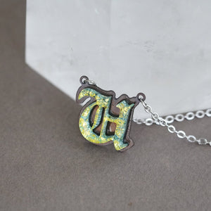 Initial letter Necklace U Old English Font Gold color Fused Dichroic Glass on a Stainless Steel base