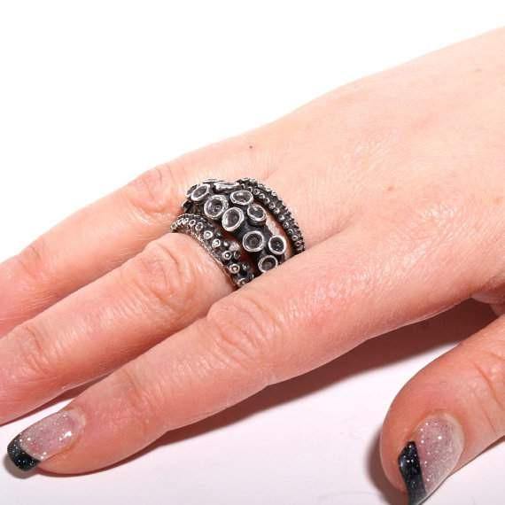 Double octopus tentacle ring in sterling silver, worn on hand