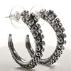 Octopus tentacle hoop earrings in sterling silver, front view