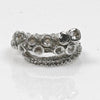 14k white gold octopus tentacle ring with white sapphires and a black diamond set in the suction cups, front view