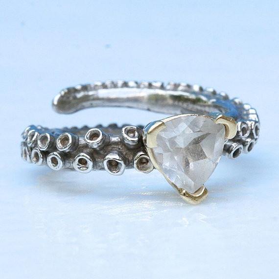 Close-up of white topaz stone on 14k gold octopus tentacle ring