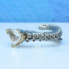 Octopus tentacle ring in 14k white gold, side angle showing topaz setting