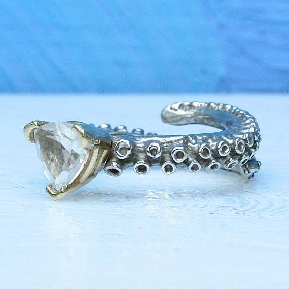 Octopus tentacle ring in 14k white gold, side angle showing topaz setting