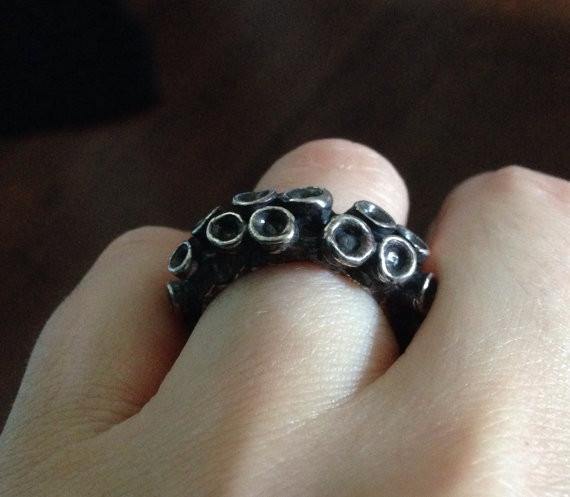 Octopus tentacle wedding band ring in sterling silver, side view showing suction cup detail