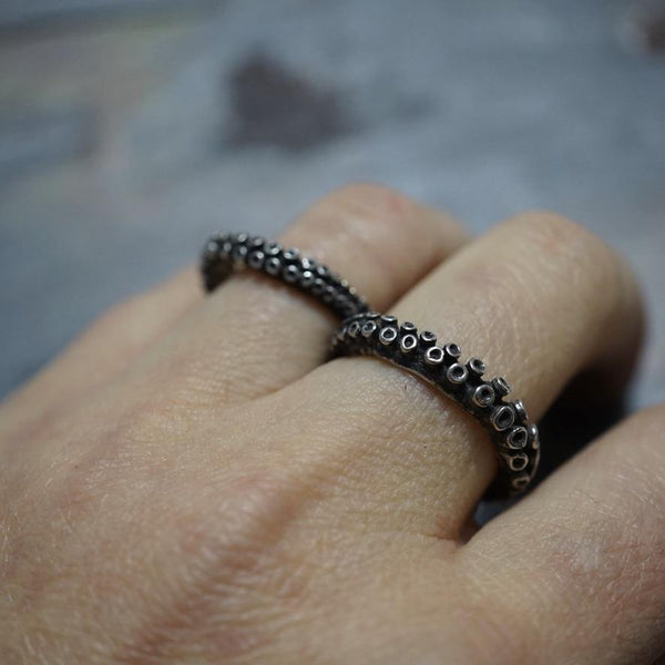 Octopus tentacle two-finger ring in sterling silver, worn on hand