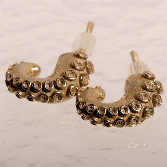 Small octopus tentacle earrings in sterling silver, close-up